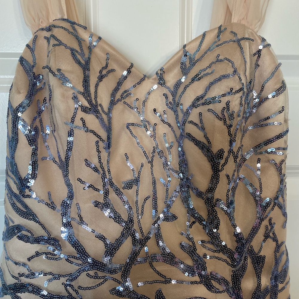 Selling a Brand New Gala Dress. Color is nude with purple sequin lace throughout